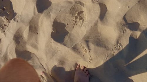 SLOW MOTION POV Adult Man Bare Feet Walking Along Yellow Sand Beach First Person View