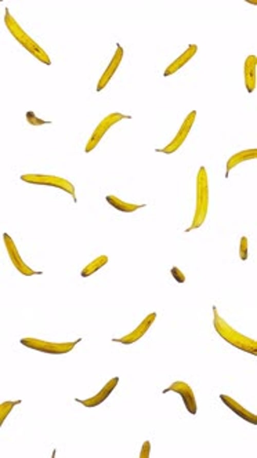 Vertikal schwimmende Bananen auf weißem Grund