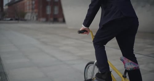 Businessman Falls off Bicycle then Waves