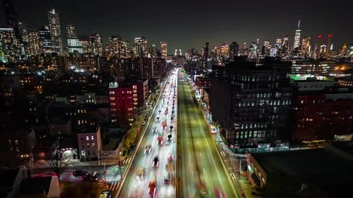 Forwards Fly Above Busy Multilane Expressway in Night Metropolis