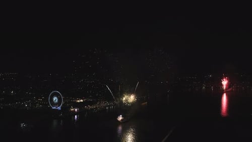 Fireworks Exploding Over a City at Night