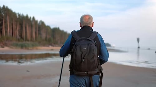 Aged Sports Man Backpacker Walking Stick Healthy Lifestyle Training Sunset Beach Landscape Back View