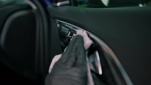 close up Detailing male car service employee performs dry cleaning and washing of car interior
