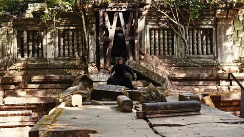 Demon Catching And Swinging Sword At Ruins