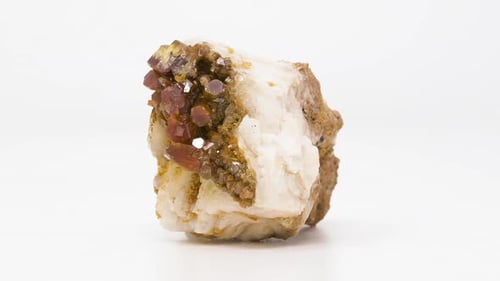 Extremely close view of Vanadinite on Barite mineral. Rotating front to back.
