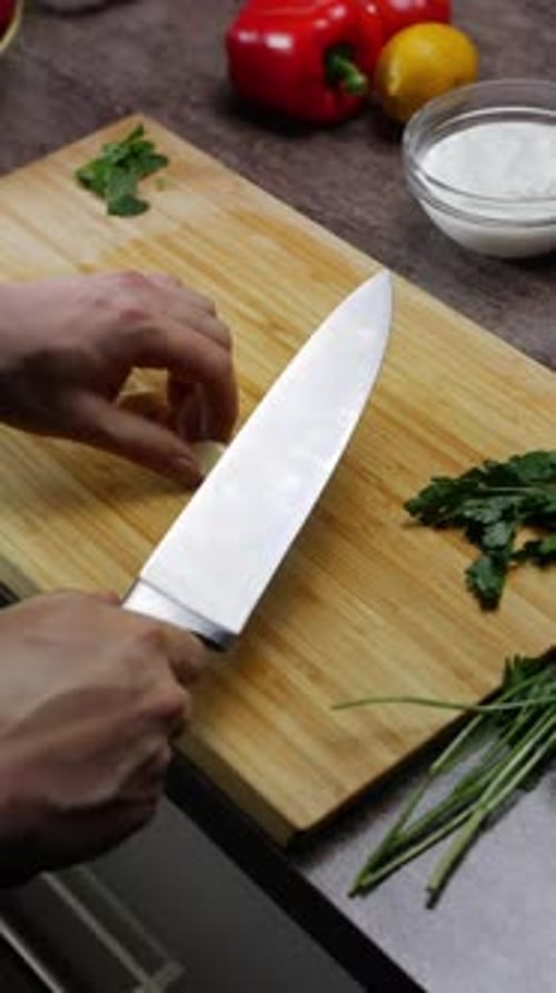 Chef Slices Garlic for Salad