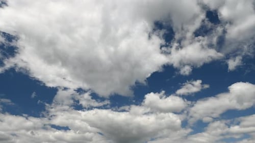 Clouds running over blue sky in summer