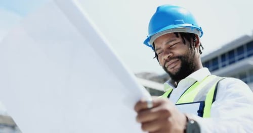 Black man, architect and blueprint in city for planning, construction or building with safety helmet