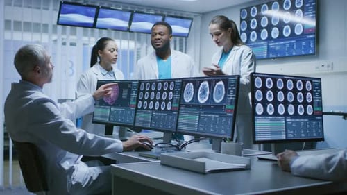 Medical Team Discussing Brain Scans in Modern Office
