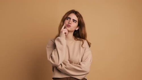 Young Woman Thinking Gets a Great Idea