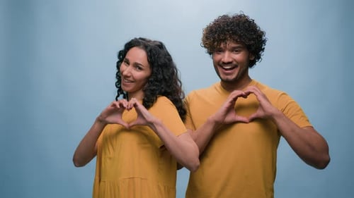 Blue Studio Background Happy Multiracial Couple Showing Heart Shape St Valentines Day Romantic