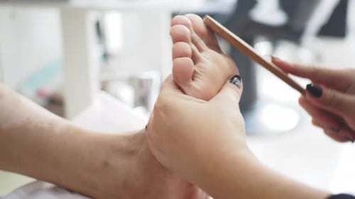 Adult Receiving Foot Care Treatment and Massage