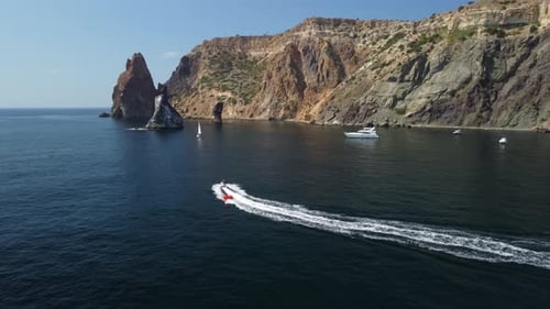 Jet Ski Pulling Tube on Blue Ocean