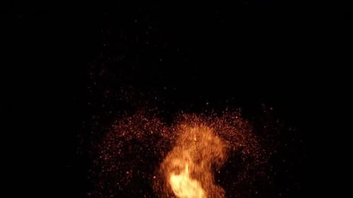 Huge campfire spits many sparks in the nightsky. Fire overlay