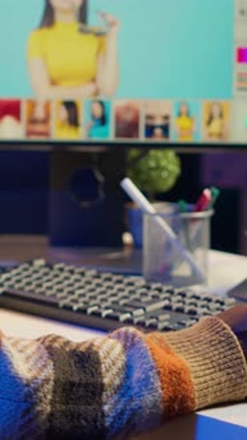 Person Using Computer with Image Editing Software