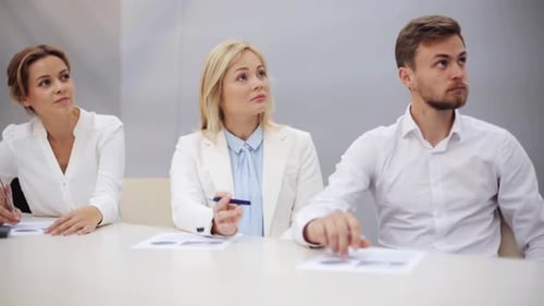 Teamwork, Corporate And People Concept - Business Team With Charts At Presentation In Office