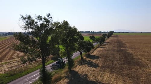 Aerial View of Country Road Near Agriculture Fields