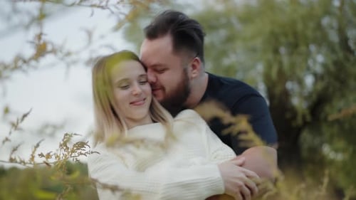 Romantic Couple Embracing in a Natural Setting