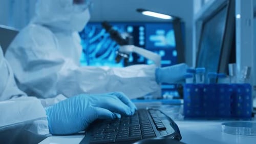 Scientists working in a futuristic blue laboratory