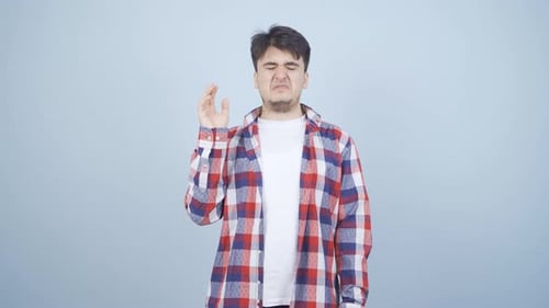 The man is disgusted.