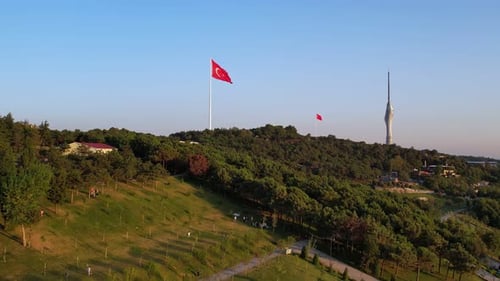 Urban Park with Flag and Modern Tower
