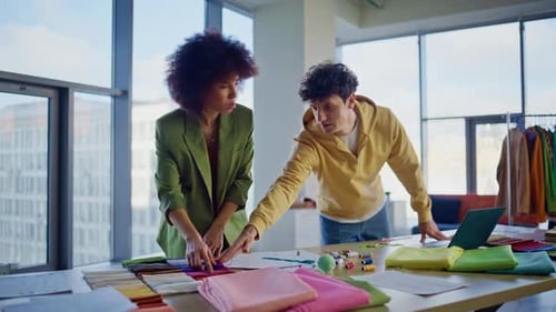 Two Fashion Designers Choosing Fabric Samples in Atelier Office Creative Team
