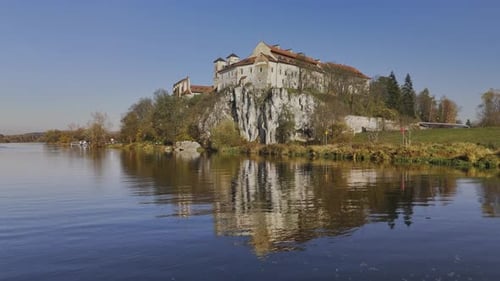 Aerial Drone Low Altitude Flytoward Tyniec Abbey Over Vistula with Autumn Reflections