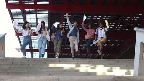 Diverse female friends and classmates talking happily as they leave the college campus. student girl
