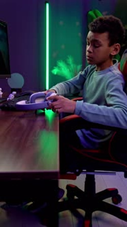 Young Person Gaming at Home at Night