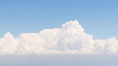 Timelapse Dense Clouds Racing Into the Distance Across Blue Sky on a Sunny Day.