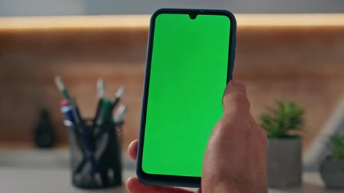 Unknown Guy Looking Chroma Key Cellphone Working at Company Office Alone Closeup