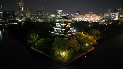 Aerial video of the Hiroshima skyline with Hiroshima Castle in Japan
