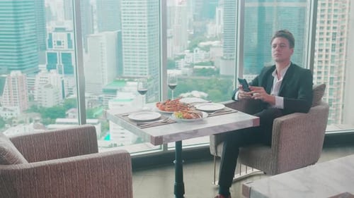 Happy young couple sitting and conversation together in anniversary at restaurant for celebration.