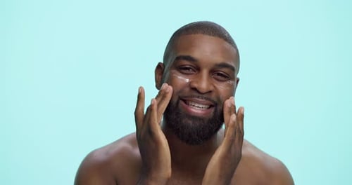 Cream, beauty and face with black man in studio for skincare cosmetics, dermatology or self care