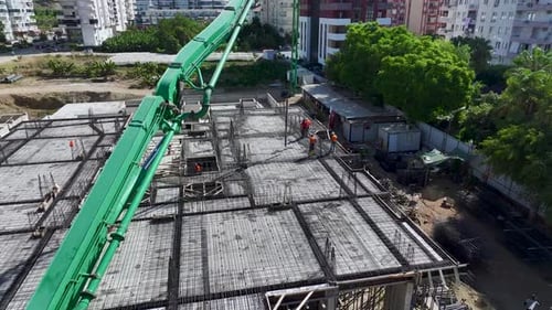 Aerial View Workers Pouring Concrete and Bending Steel Rebar for Building Foundation