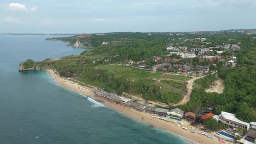 Amazing aerial view of balangan beach in bali, indonesia. Turquoise ocean waves crashing on the