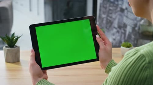 Woman Holding Tablet with Green Screen Display