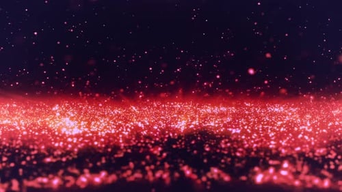Glowing red particles fall against dark background
