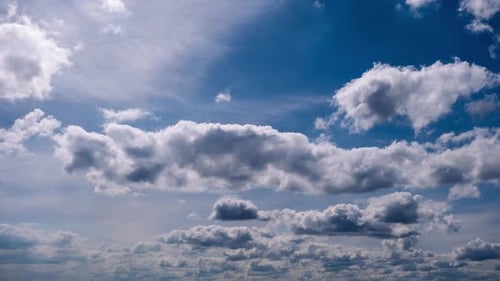 Timelapse of Cumulus Clouds Moves In The Blue Sky