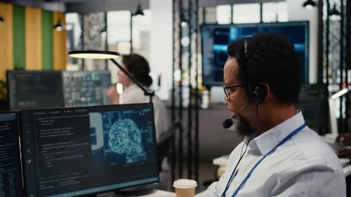 Close Up of Startup Software Developer Doing Tech Support Helping Users