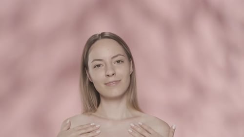 A Woman Enjoys Her Ideal Skin Touching Her Shoulders with Both Hands Throws Her Head Back Runs Her