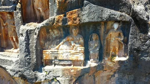Ancient Stone Carvings on Rock Face