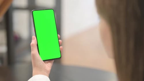 Close up of Young Woman Using Phone with Green Screen