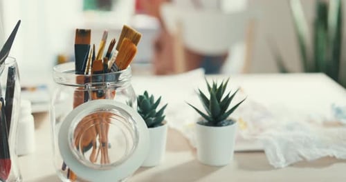 Close-up selective focus on foreground painting equipment color water, oil and acrylic brush.