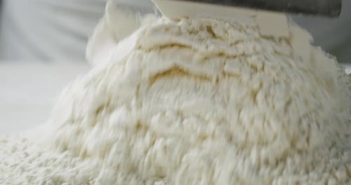 Flour Being Sliced on a White Surface