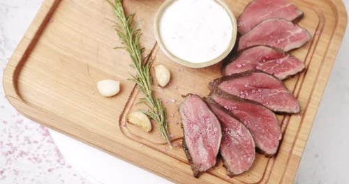 Close up Rare Sliced Beef with Garlic
