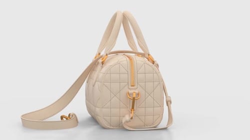 Cream Handbag with Gold Hardware Spinning on Display