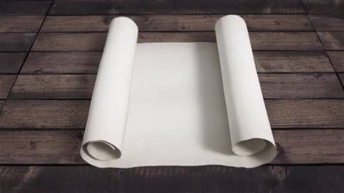 Anciente white Scroll Opens on wooden background