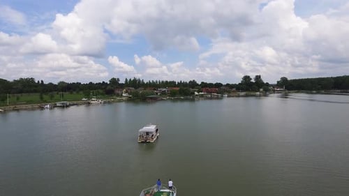 Boats Sailing On A River