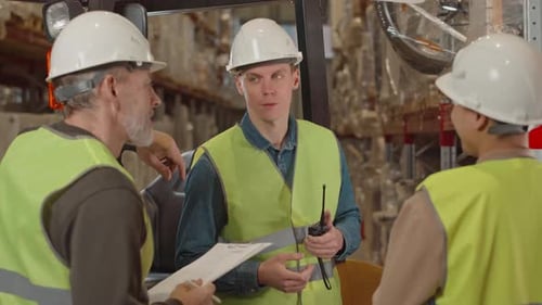 Coworkers Having Conversation at Warehouse